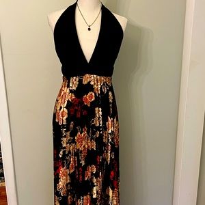 Beautiful halter gown with black built in bra halter top and pleated bottom.